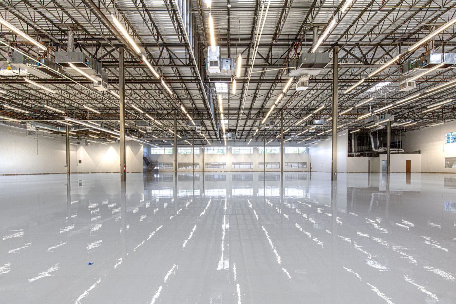 A large commercial floor finished with a high-gloss epoxy coating.